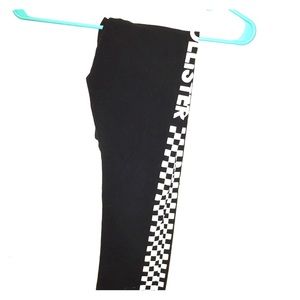Stretchy black leggings with checkers along legs